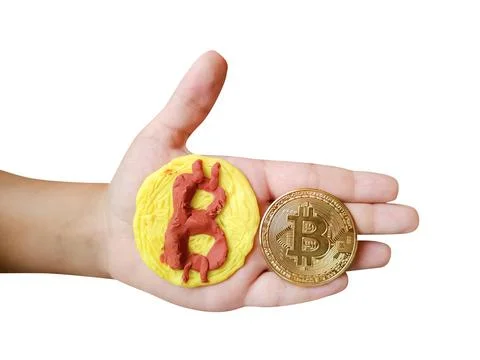 Plasticine and real bitcoin token in kid's hand isolated on white background Stock Illustration