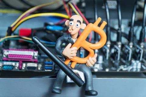 Plasticine businessman in a computer with bitcoin Stock Photos