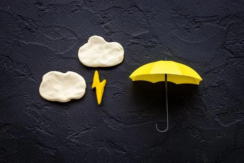 Plasticine clouds with lightning thunderbolt. Weather forecast concept Foto stock