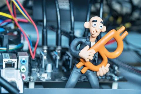 Plasticine man in a computer with bitcoin Stock Photos