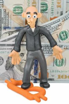 Plasticine man stepped on bitcoin Stock Photos