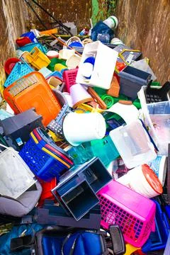 Plastic.Recycling of garbage, plastic products. Old broken things in a container Stock Photos