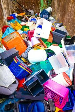 Plastic.Recycling of garbage, plastic products. Old broken things in a container Stock Photos