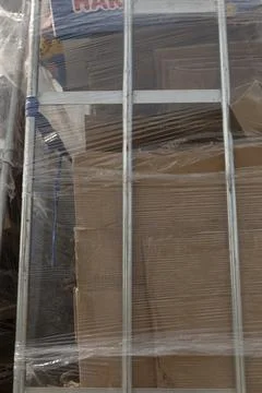 Plasticwrapped pallets with corrugated textures indicating circular reuse Photos