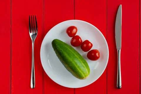 Plate and cutlery on the table. Fork and knife on an empty plate. Suitable fo Stock Photos