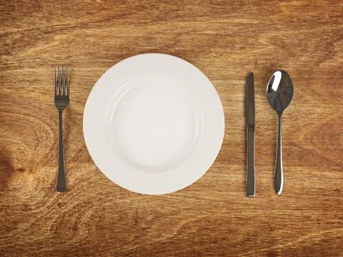 Plate and flatware on wooden table Illustrazione stock