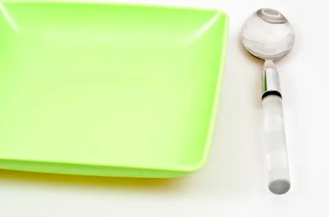 Plate and spoon 스톡 사진
