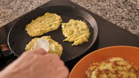 On plate are vegetable pancakes made from grated zucchini Stock Footage 327698164