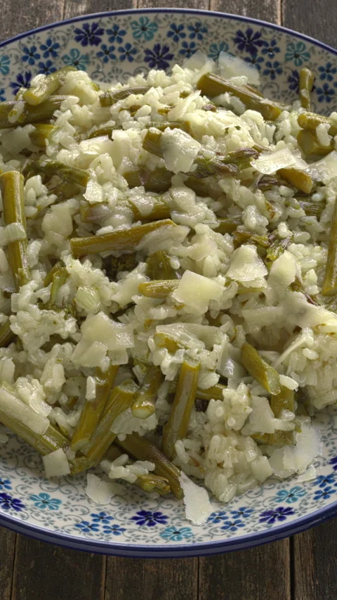 A plate with asparagus risotto. Video stock 334548204
