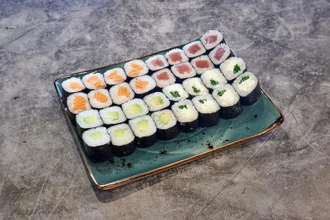 A plate of assorted sushi rolls Stock Photos