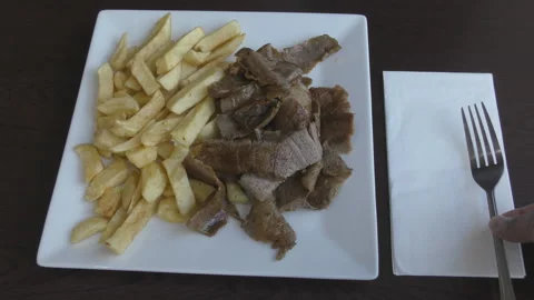 A plate of beef kebab with chips. Stock Footage 99945813