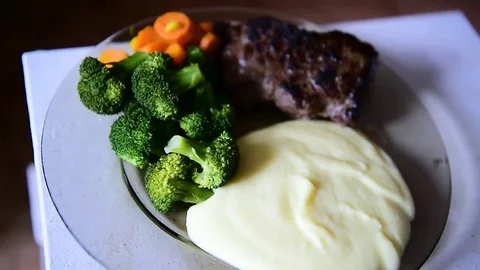 Plate with beef steak, mashed potatoes, carrots and broccoli 스톡 동영상 69205652