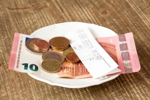 Plate With Bill And Tip On Table Stock Photos