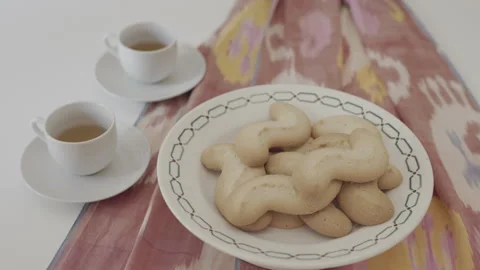 Plate with biscuits and cups of coffee Stock Footage 327953304