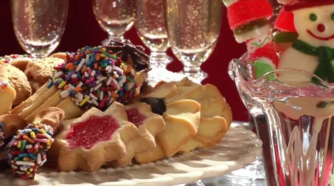 Plate of biscuits, candy canes and Chocolate Father Christmases Stock Footage 8574030