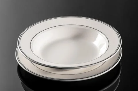 Plate on black background Stock Photos
