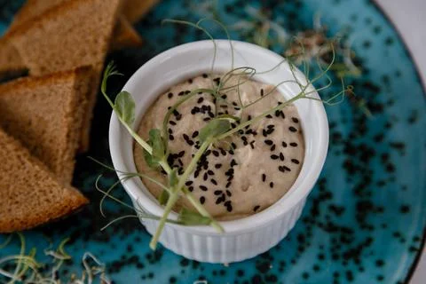 A plate with black bread and a bottle on the table in a restaurant Stock Photos