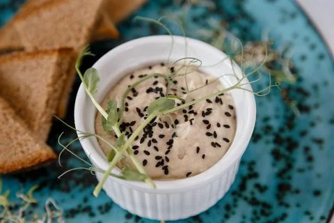 A plate with black bread and a bottle on the table in a restaurant Stock Photos