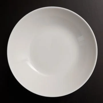 Plate on black Stock Photos