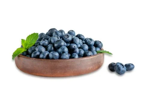 Plate with blueberries closeup and a leaf of mint isolated on a white backgro Stock Photos