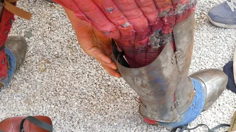 Plate boot is worn on the leg. Stock Footage 123583949