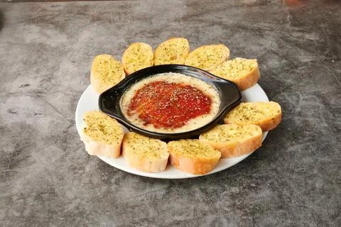 A plate of bread and a dip Stock Photos