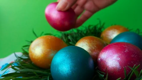 Plate with bright multi-colored shiny Easter eggs Stock Footage 105926232