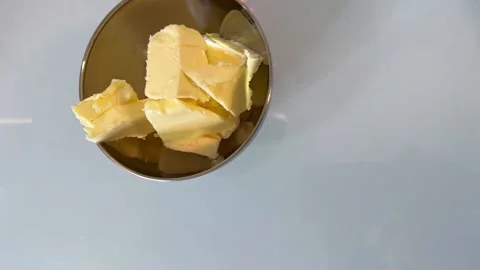 Plate with butter is put on the table Video stock 228725900