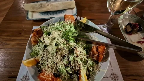 Plate Of Caesar Salad Garnished With Balsamic Glaze And Parmesan Cheese At Stock Footage 337925400