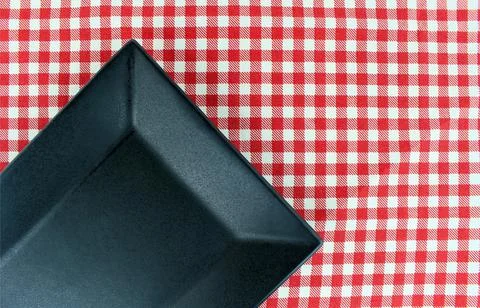The plate on checkered tablecloth Foto stock