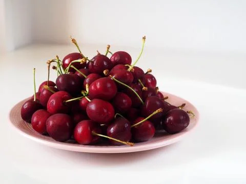 Plate with cherries Stock Photos