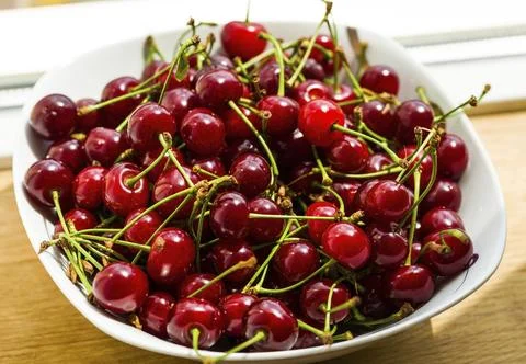 Plate. cherries Stock Photos