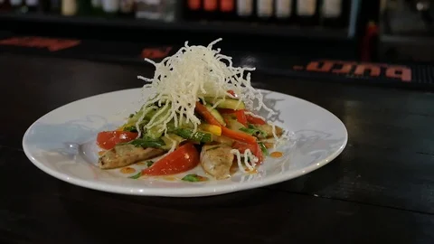 Plate with chicken salad on table Video stock 102449931