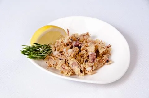 A plate of chipirones on a white background Stock Photos