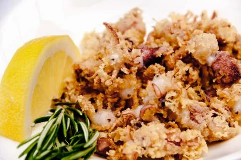 A plate of chipirones on a white background Stock Photos