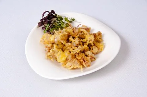 A plate of chipirones on a white background Stock Photos