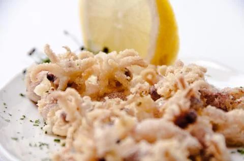 A plate of chipirones on a white background Stock Photos