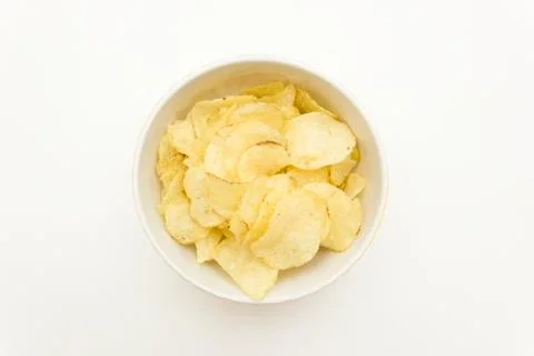 Plate with chips on a white background top view Stock Photos
