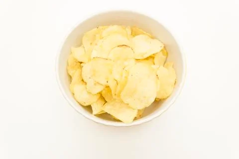 Plate with chips on a white background top view Stock Photos