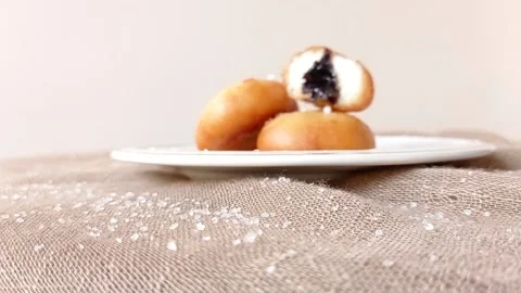 A plate of chocolate buns on a brown table Stock Footage 146249384