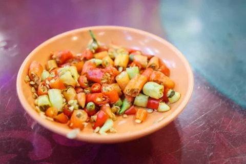 A Plate of Chopped Chilli Padi on a Table Stock Photos