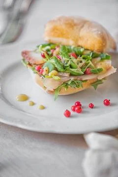 A plate of ciabatta with fish on a table Foto stock