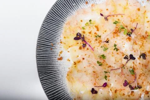 Plate of cod carpaccio seen from above Stock Photos