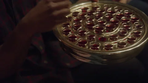 Plate of Communion Wine Being Passed in Church Stockbeeldmateriaal 208802216
