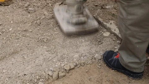 Plate compactor roller equipment machine flatten the pavement at construction Stock Footage 74443615