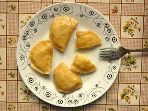 Plate of Cooked Pierogi On Table Stock Photos