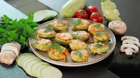 In a plate of cooked zucchini stuffed with cheese, herbs and mushrooms Stock Footage 270151007