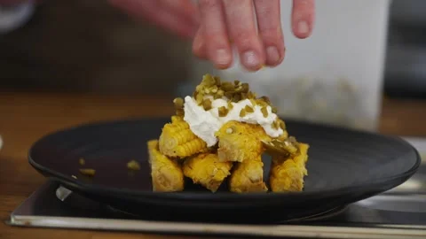 A plate of corn on a wooden table Video stock 301630043