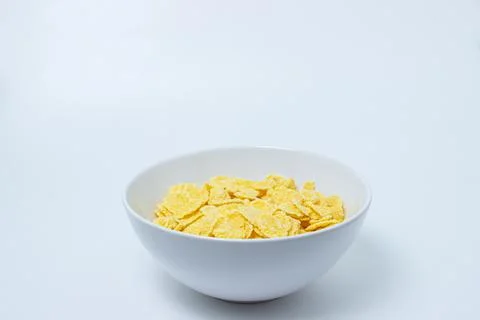 Plate with cornflakes on a white background Stock Photos