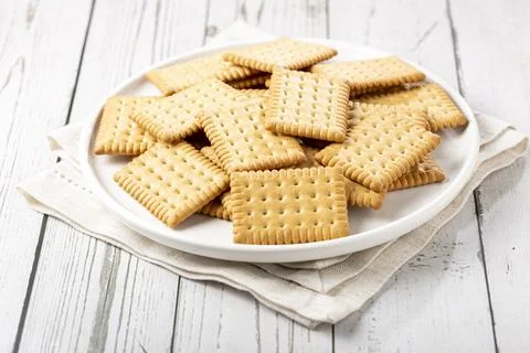 Plate with cornstarch biscuit on the table. Stock Photos